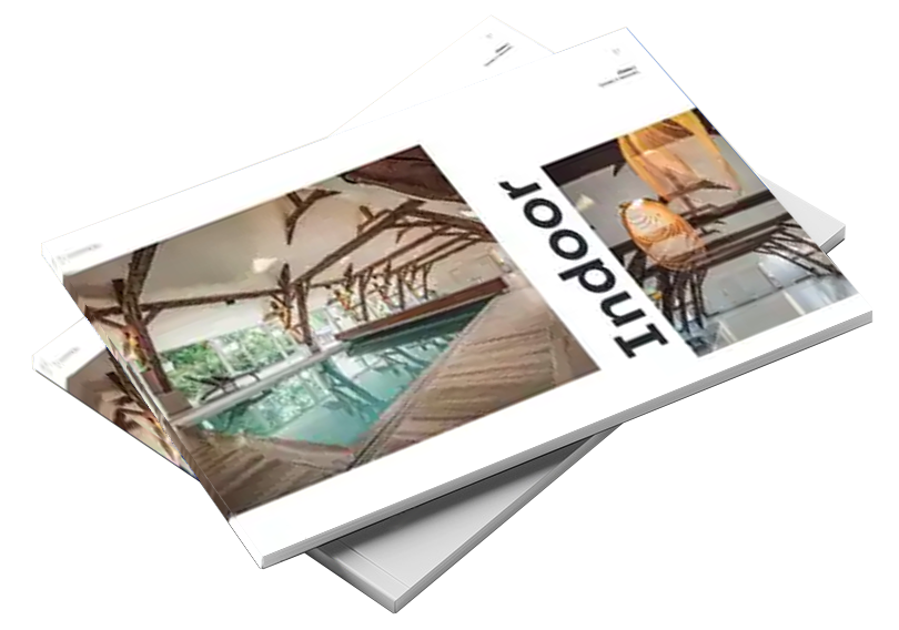 Catalogue avec couverture montrant une piscine intérieure entourée de poutres en bois, avec le mot "Indoor" visible en noir.
